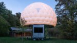 mobile sleeping hut combines stainless steel trailer with double-shell inflatable dome