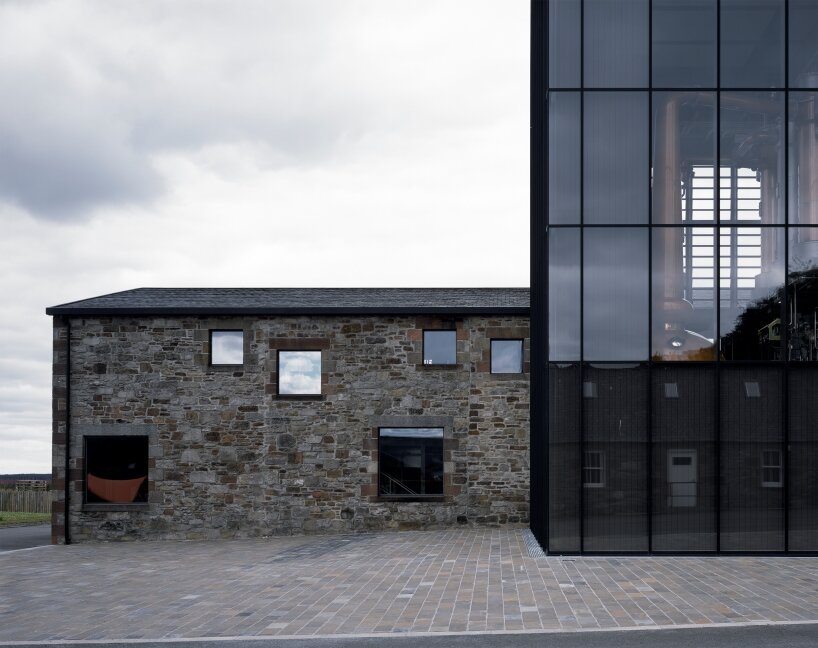 transparent lighthouse by barthélémy griño extends whisky distillery in scotland